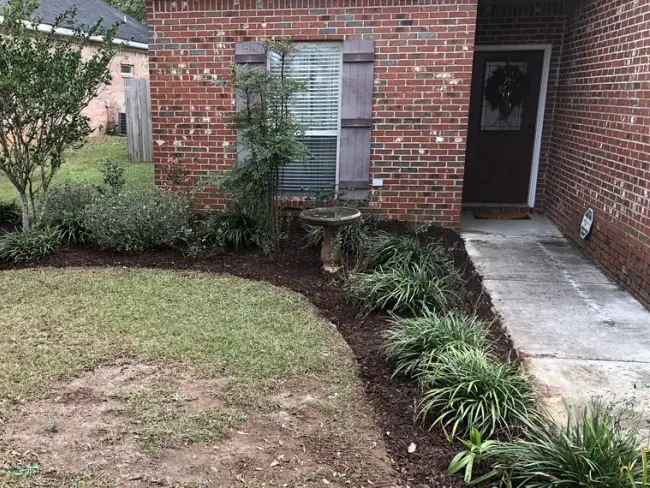 Mulch installation at a basic front flowerbed