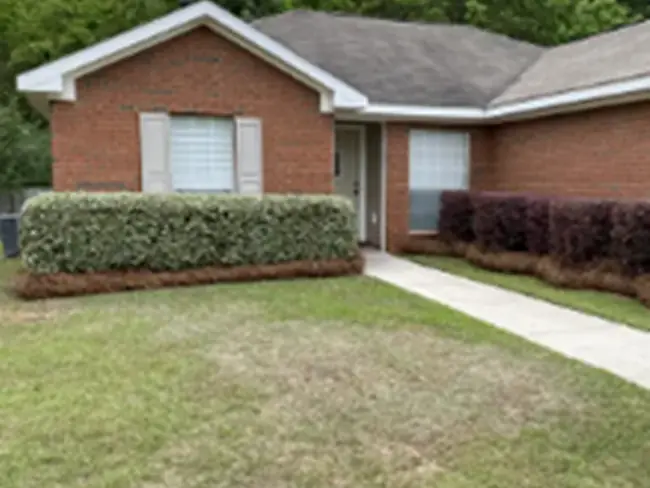 Pine straw installation at a West Mobile property